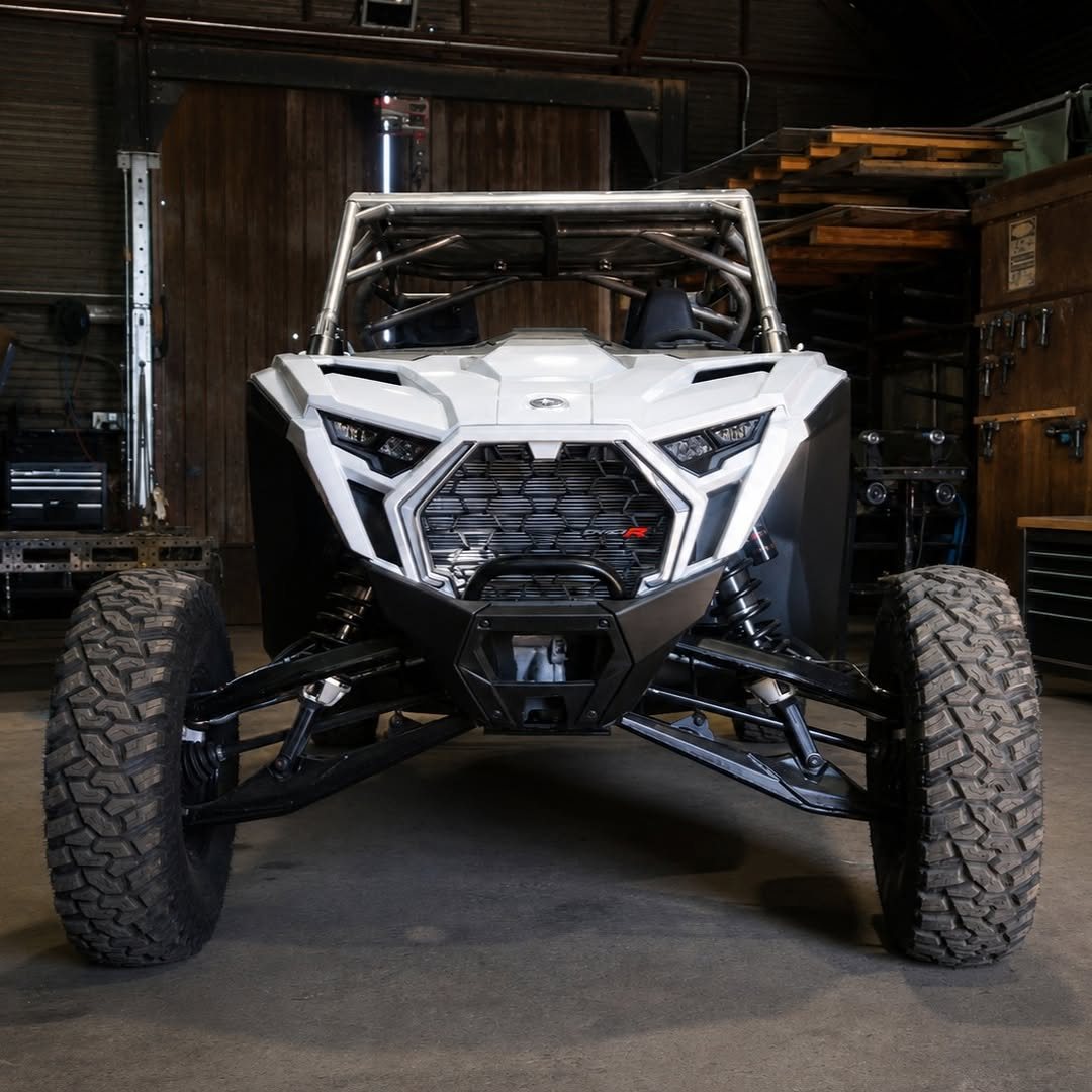 White Polaris RZR Pro R custom cage front view in shop